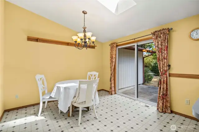 Ample dining space with access to the patio and backyard. You will love the flow of this house with the living room open to the dining area.