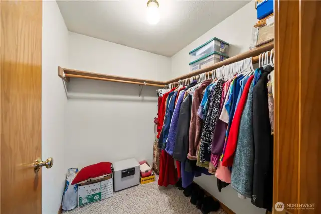 Lots of room in this primary walk-in closet.
