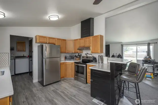 Kitchen with quartz countertops and stainless steel appliances
