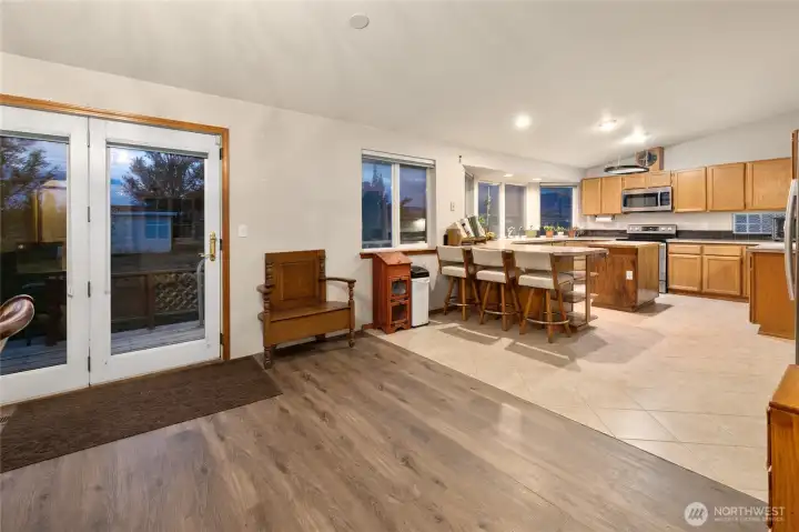Open Kitchen and dining with updated flooring.