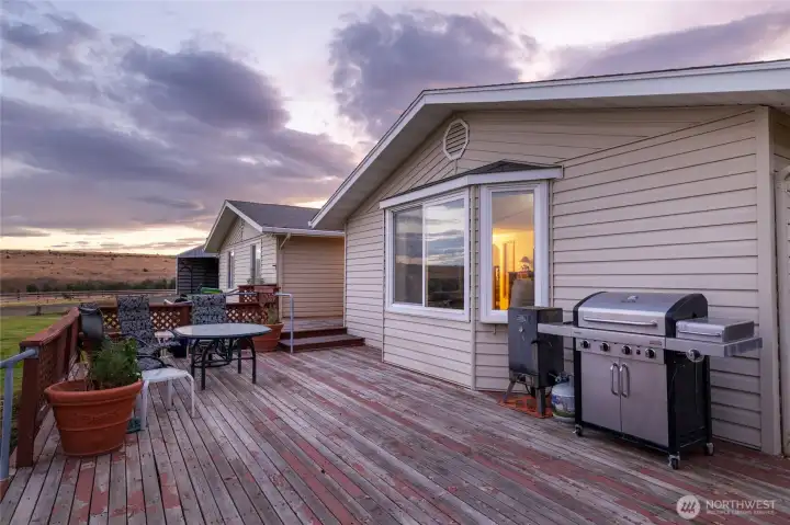 Enjoy beautiful sunsets and family time on the 3/4 wrap deck