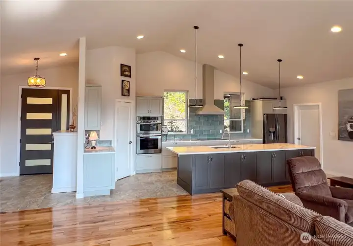 Modern design front door and wide foyer. Photo taken from the dining area.