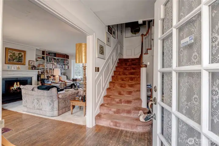 Entry with stairway leading to upper floor (3 bedrooms).  Original bathroom up with excellent expansion opportunity.