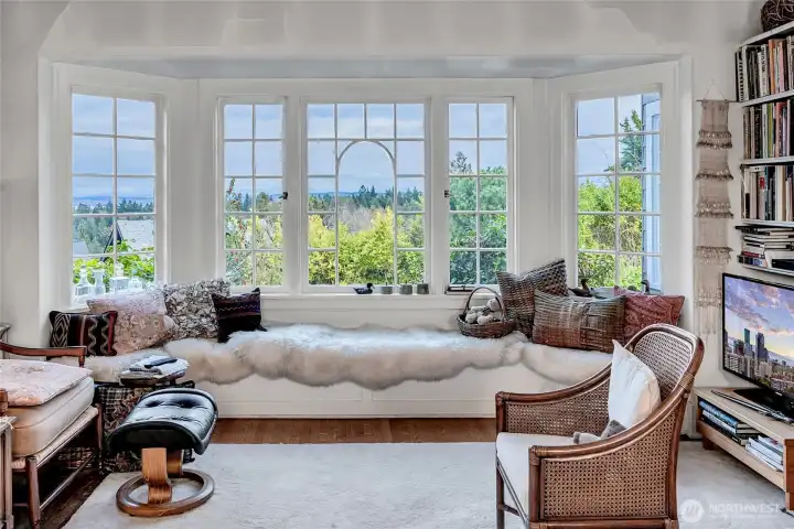 Living room overlooking huge back garden/yard connecting to 2-car garage on alley.