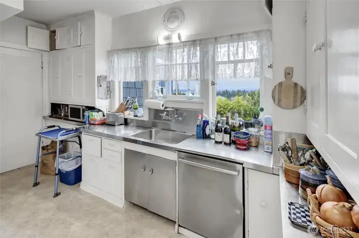 Original kitchen with sunroom to the left & little breakfast nook to the right. (not shown)