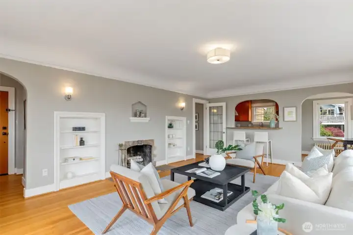 The main floor boasts newly refinished hardwood floors, plenty of built-ins, coved archways and leaded glass door.