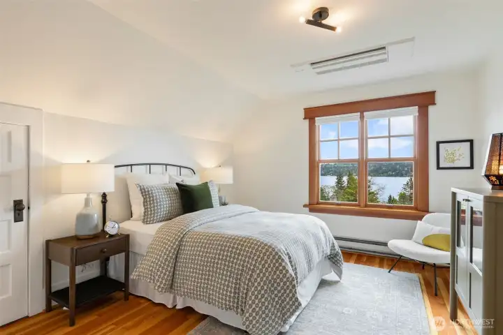 Generous, second upstairs bedroom with inviting views to enjoy