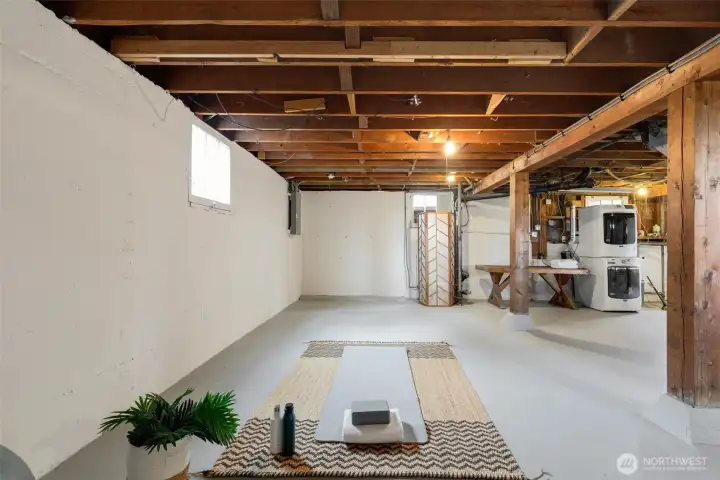 Expansive lower level with tall ceilings, presenting a range of possibilities for now and for future expansion