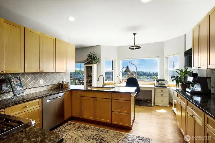Granite counters, fantastic cabinet space, and dishes won't seem so bad with this view.