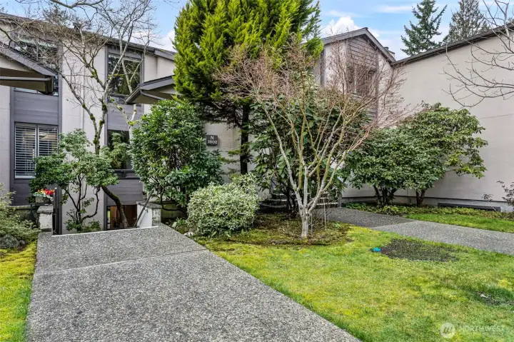 A few steps down to the front door, or there is a flat path to walk around.