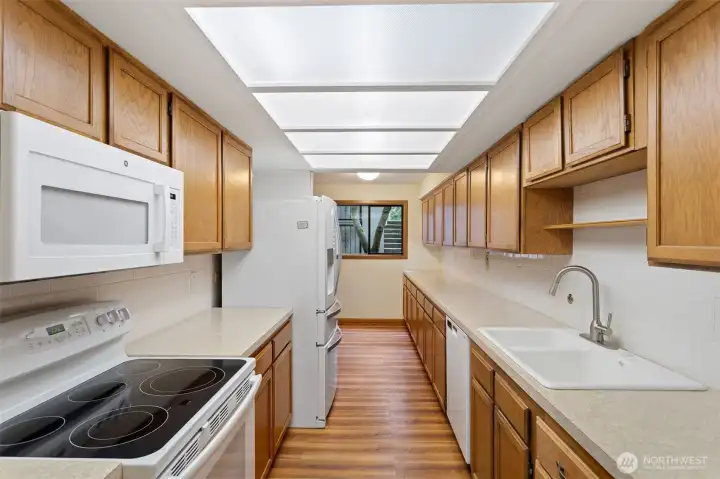 All the kitchen gadgets will fit here! Classic oak cabinets.