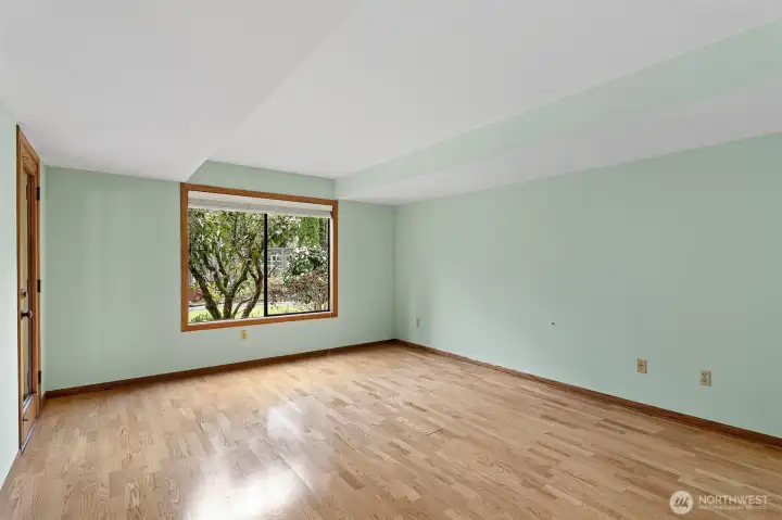 Primary bedroom with window to the gardens.