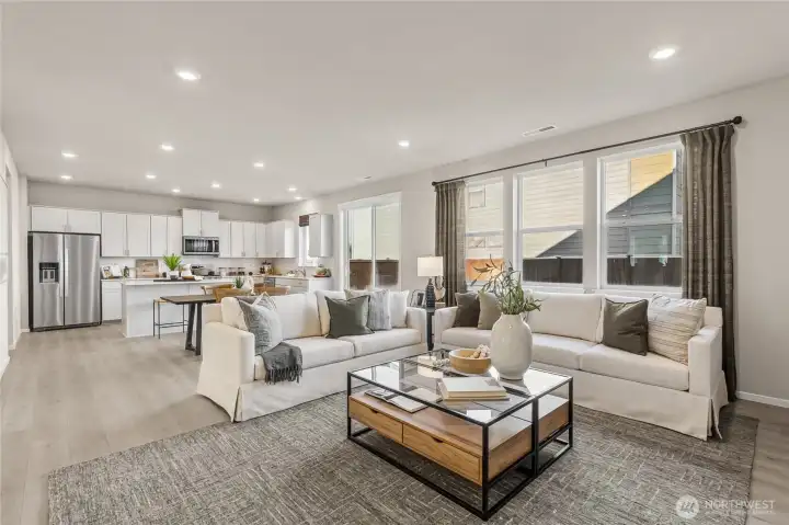 Spacious great room with open layout, large windows, and modern finishes throughout. For illustration purposes and some variation may apply.