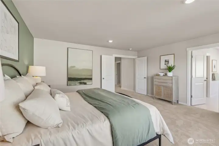 Primary bedroom spacious layout with access to the walk-in closet and ensuite bathroom. Double doors give it a very grand feel. Photos are representative only and may display different color package and/or upgrades.