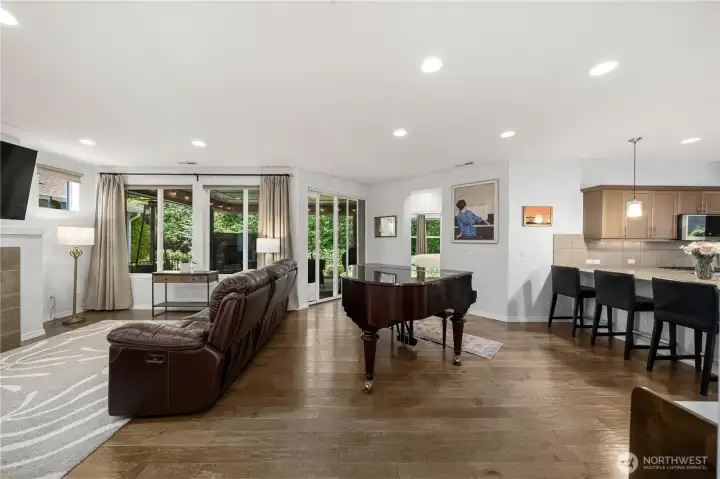 Engineered hardwood flooring throughout all main living spaces including bedrooms. Piano is where most owners put their dining room table.