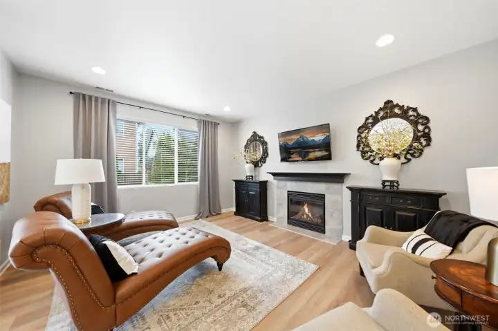 Bright and spacious great room with a cozy fireplace. Bright and spacious great room with a cozy fireplace.