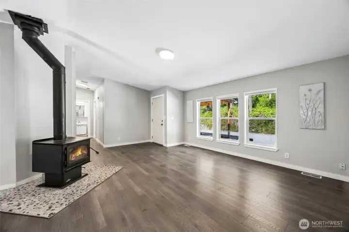 Front entry w/ wood stove and spacious living room.