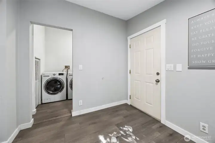 Laundry room w/80 gallon hot water tank.