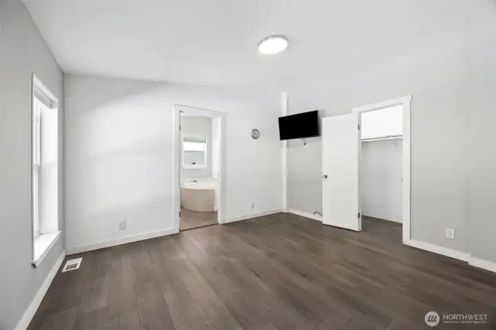 Master bedroom w/ walk in closet.