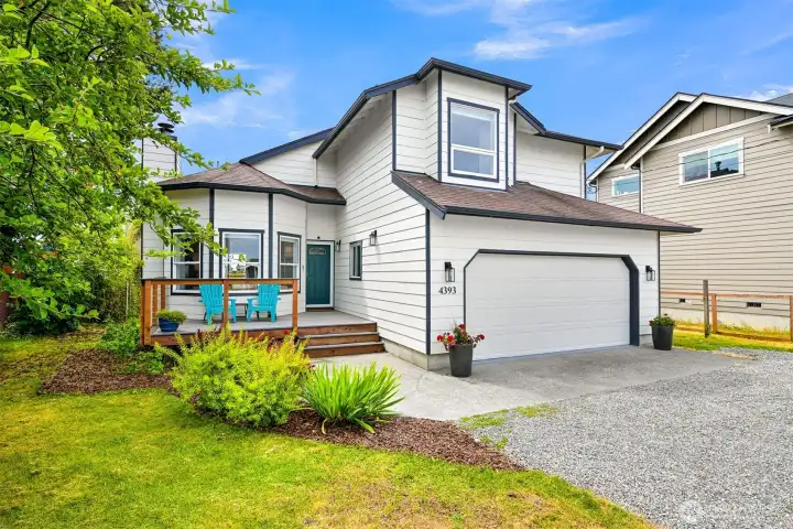 Attractive curb appeal welcomes you home with a spacious driveway, attached two-car garage, and inviting covered front porch.