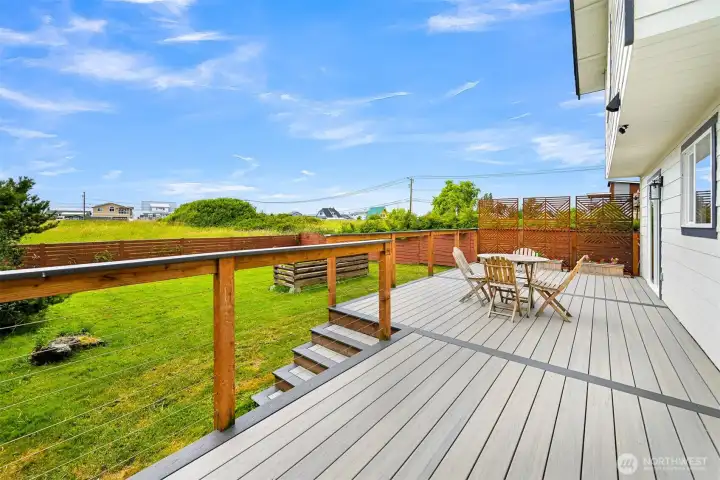 The fully fenced backyard provides plenty of room to spread out, whether you're gardening, playing, or simply enjoying time outdoors. Mature landscaping adds privacy and greenery throughout the space.