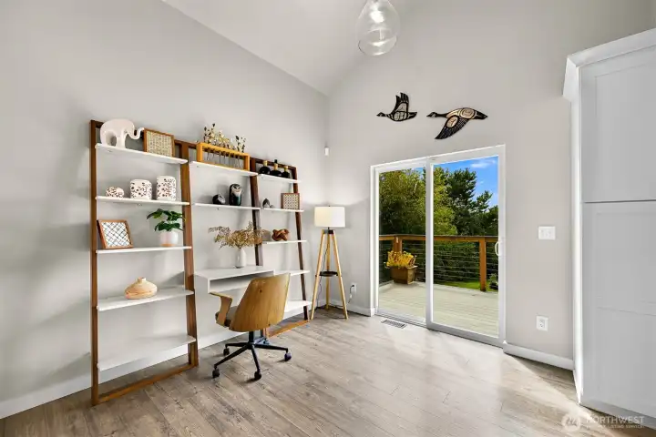 Whether working from home or pursuing hobbies, this flexible space provides abundant natural light and convenient access to outdoor living.