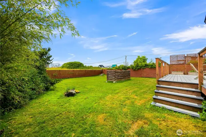 Enjoy the best of indoor-outdoor living with an expansive deck overlooking a large, level backyard. The spacious outdoor setting offers endless possibilities for entertaining, recreation, or future landscaping ideas.