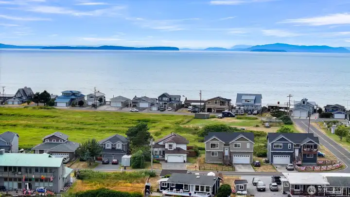 Located just a short distance from the shoreline, this home offers the opportunity to enjoy sunsets, beach walks, and the beauty of the bay.