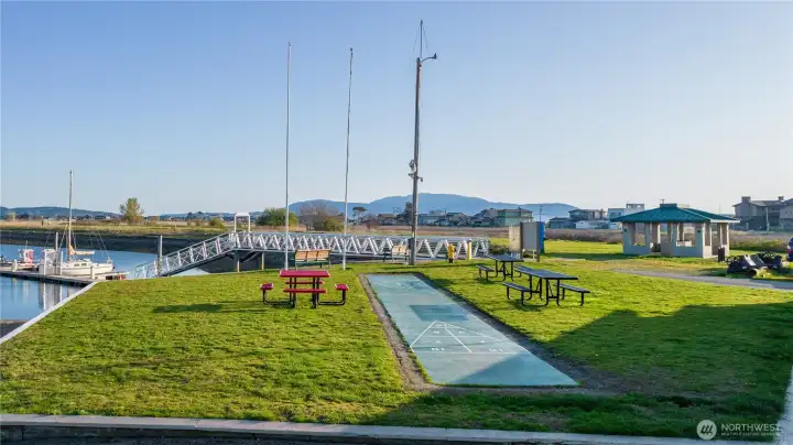 Pack a picnic and spend evenings playing and socializing in the community green space and play a game of shuffleboard.
