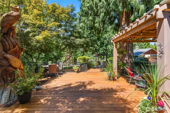 “Expansive 900-square-foot bamboo deck with railing, ideal for entertaining.” “Expansive 900-square-foot bamboo deck with railing, ideal for entertaining.”