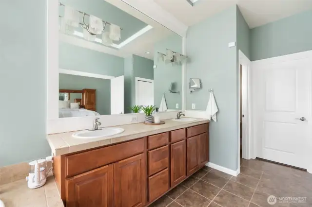 Double sinks and ample storage make the primary bedroom a perfect blend of style and practicality.