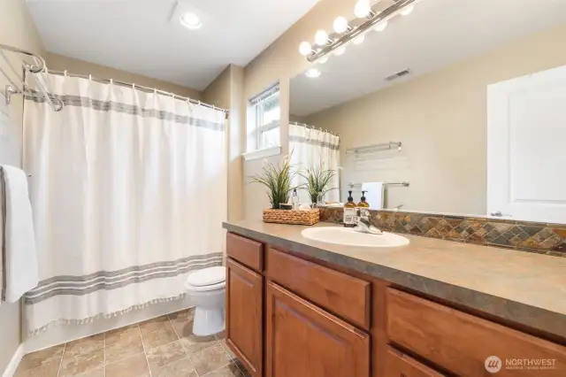 An additional bathroom upstairs provides convenience and extra space for family or guests.