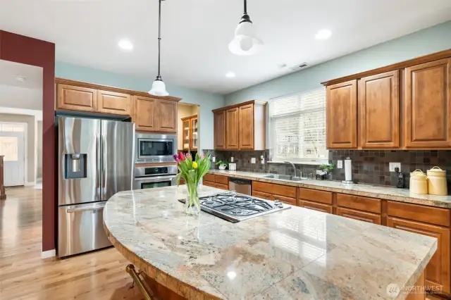 A butler’s pantry is tucked away in the corner, offering additional storage and convenience.