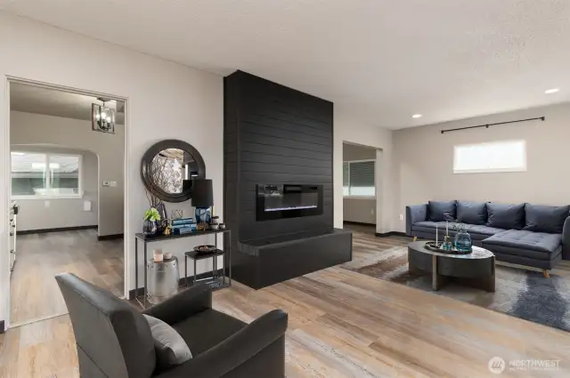 Virtually staged living area with electric fireplace