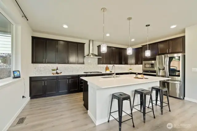 Ample cabinetry and a spacious pantry — organization dreams come true