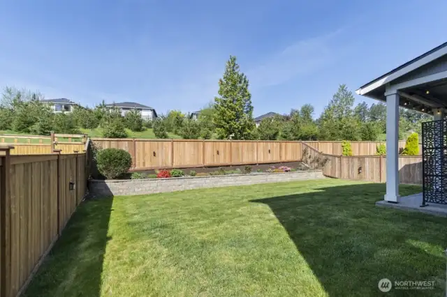 Fully fenced yard with pressure-treated cedar for lasting beauty