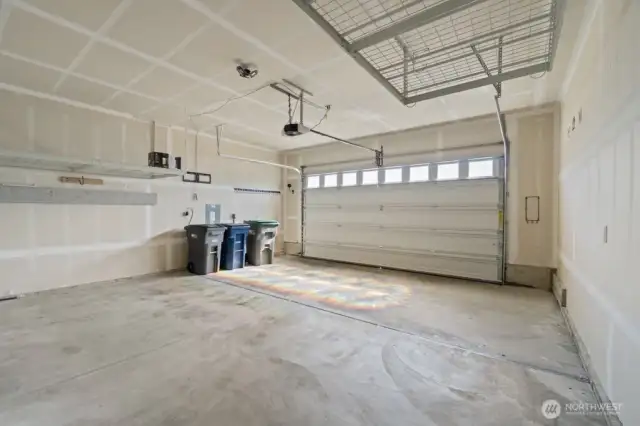 Two large overhead garage storage racks — space you didn’t know you needed