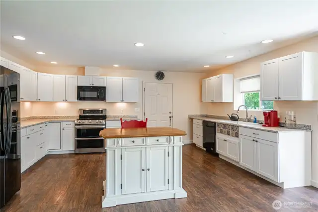 Spacious kitchen with new paint throughout