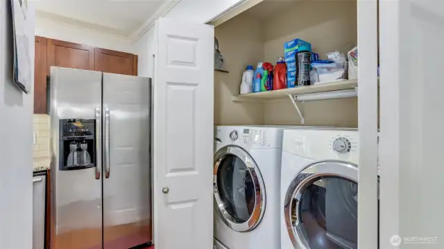 The washer and dryer are adjacent to the kitchen and remain with home.