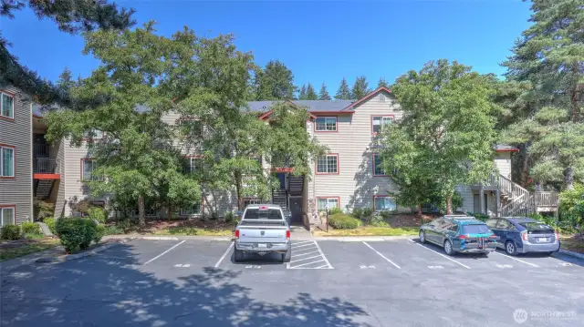 This wonderful ground level 3 bedroom with 2 baths is in the perfect location within Tanglewood.  The very close uncovered parking space belonging to this home is #27 just steps away from the front door.
