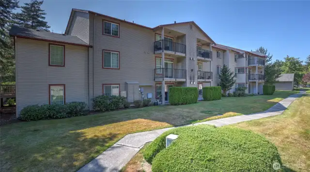 There is a long apron of grass and a sidewalk in between the 2 sets of buildings giving excellent separation and privacy.