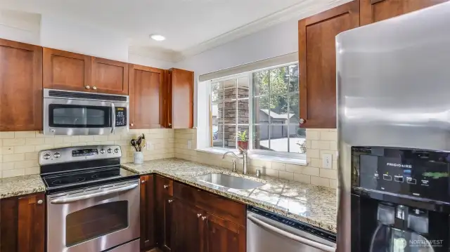 A large window that allows the sunshine to pour into the kitchen.  The electric water heater is in the spacious closet next to the kitchen.