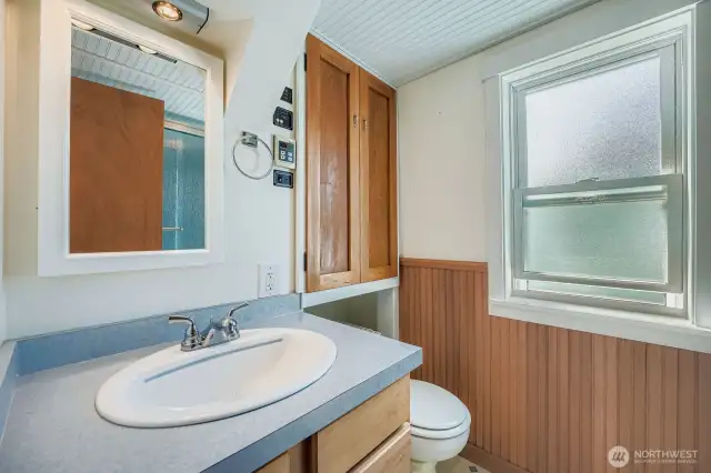 Full bathroom and more storage... Systems panel on the wall.