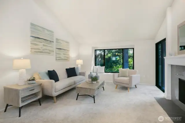 Large living room with vaulted ceiling and lots of natural light.