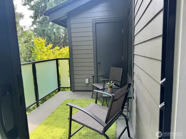 Patio overlooking the greenbelt area with a large storage closet.