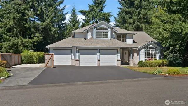 The open gate to the left reveals even more paved parking, ready for your boat, RV, or trailer!