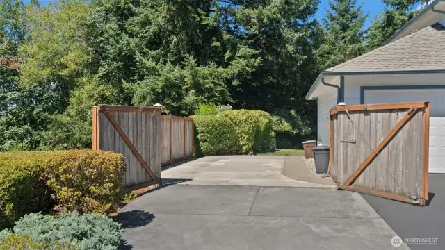 An even better look at the expansive paved parking area, offering ample space for all your extra vehicles and toys.