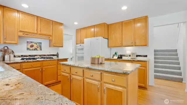 Yes - you’re cooking with natural gas! And just to the left of the refrigerator, the recently replaced wall oven and microwave make meal prep a breeze.