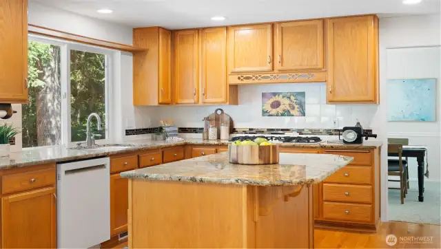 The serene forested view from the kitchen sink offers a daily dose of calm, turning even simple tasks into a peaceful moment.