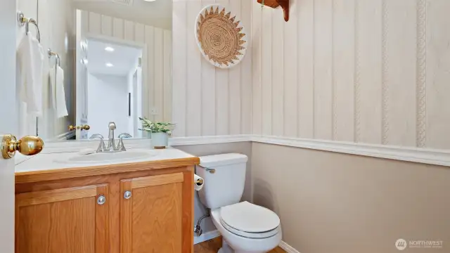 Convenient main-floor half bath, perfectly placed for guests and everyday use.